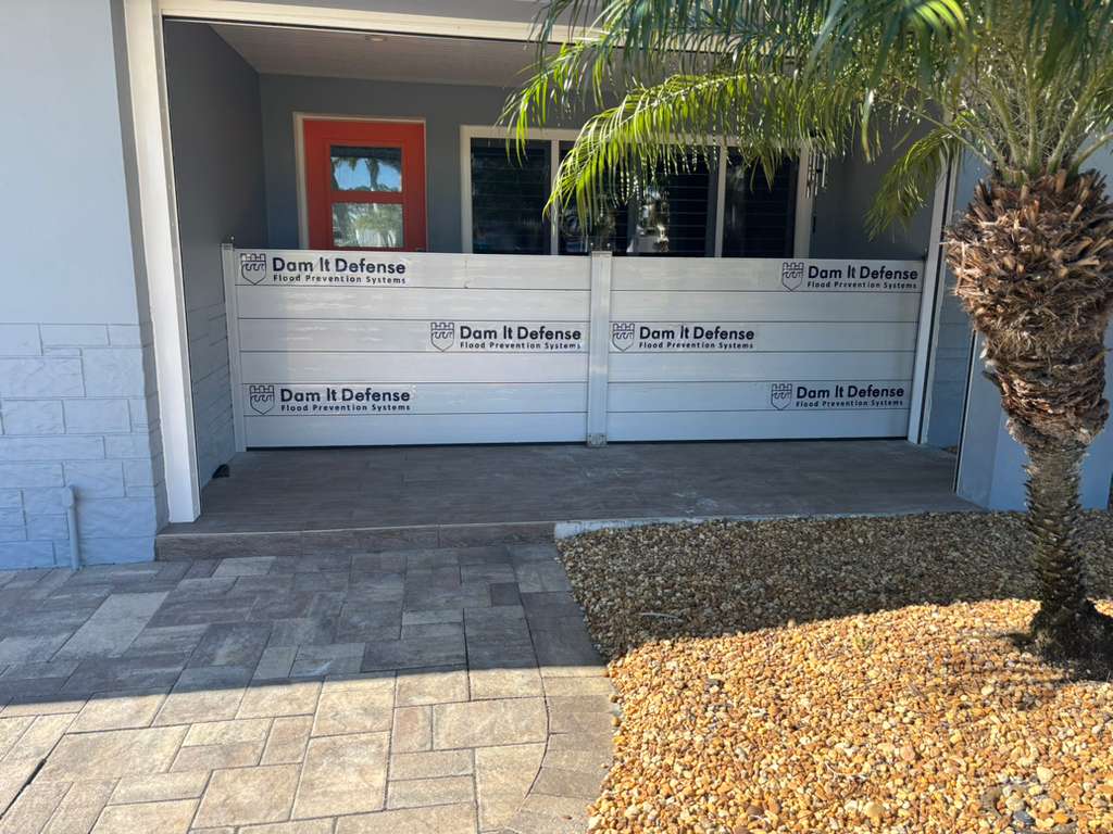 Snell Isle flood barriers protecting a home porch and entry
