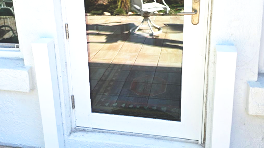 Powder coated aesthetic flood barrier cover on a residential home