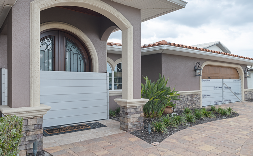 Dam It Defense flood barrier across a residential garage opening
