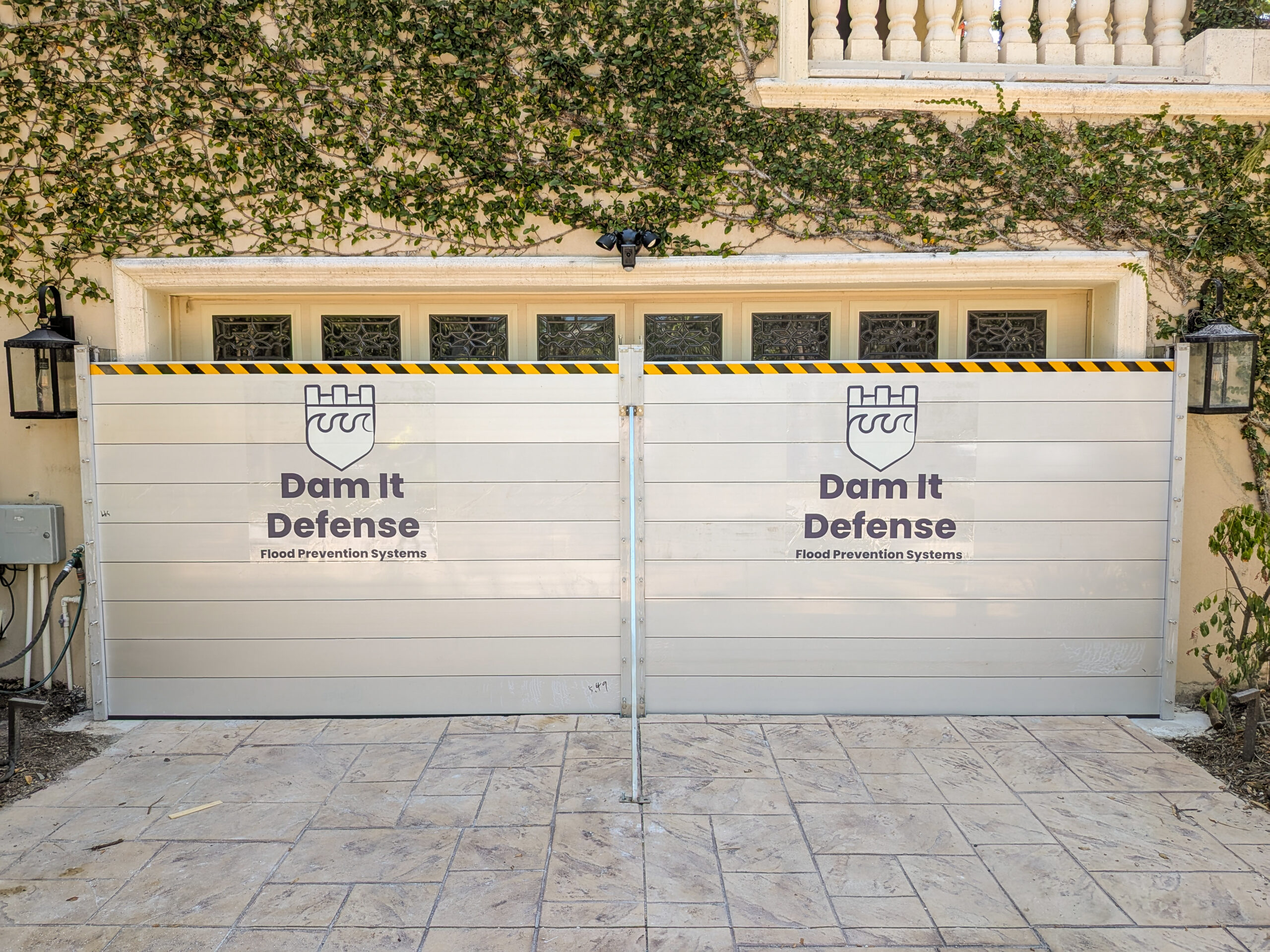 Snell Isle flood barriers installed at a residential front entry