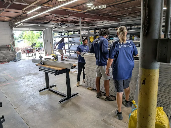 Dam It Defense fabrication floor team