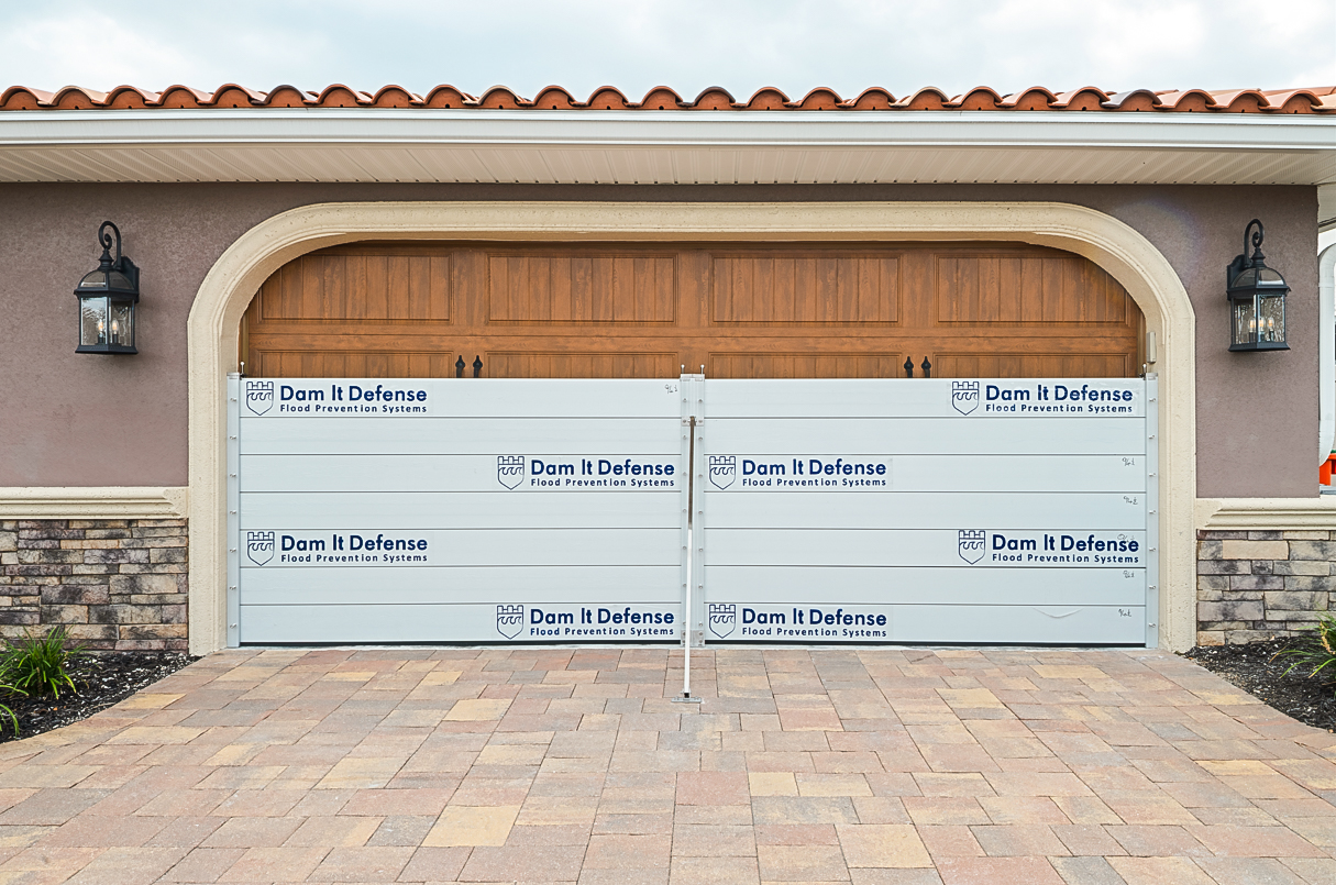 Layered home flood defense system installed on a Tampa Bay home by Dam It Defense