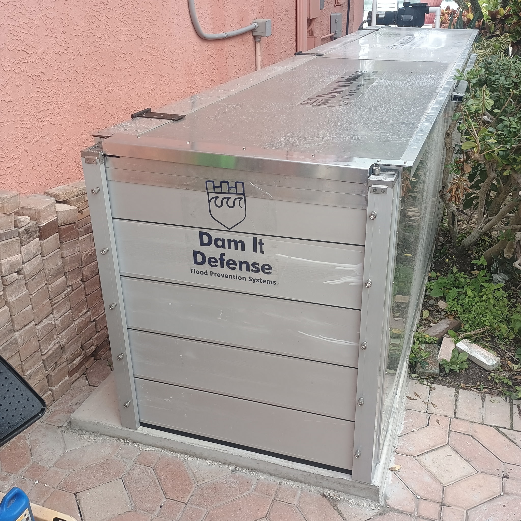 custom aluminum generator flood protection enclosure with airflow louvers in Florida by Dam It Defense